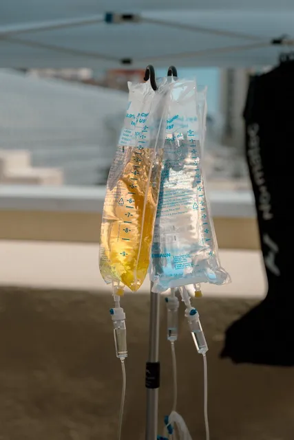 IV bags hanging from a stand at a Flow IV event.